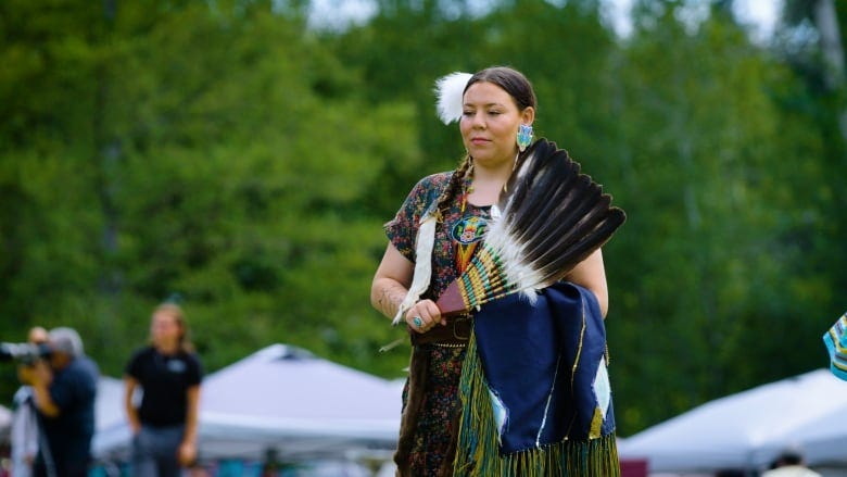 Native woman dancing with regalia