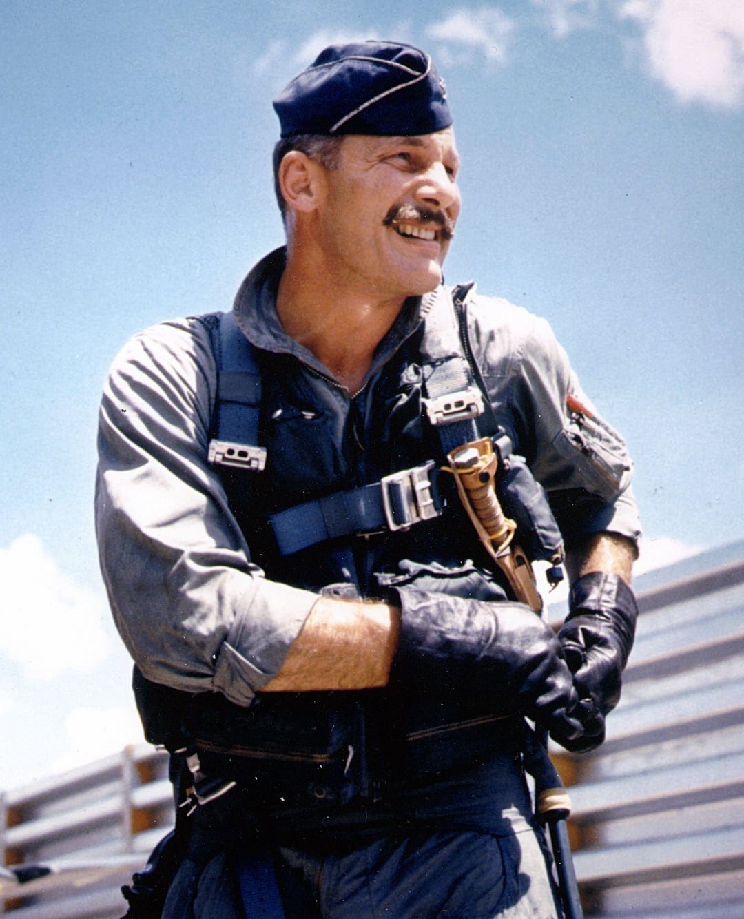 Colonel Robin Olds, a WW2 and Vietnam fighter pilot with 17 victories. His  mustache was purposefully outside of allowed Air Force regulations as a  "middle finger I couldn't raise in PR photographs". :