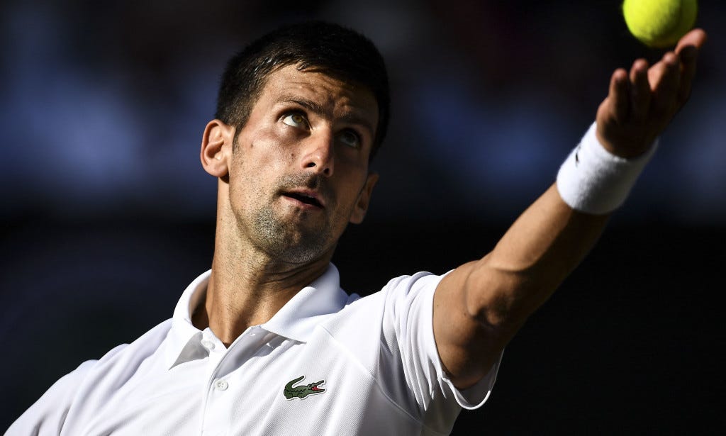 novak djokovic overcomes shoulder injury for wimbledon win