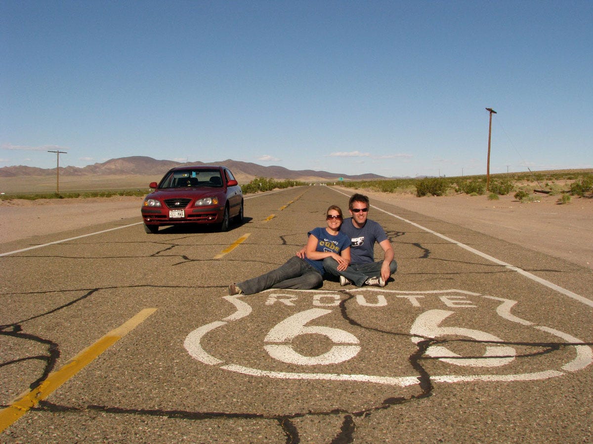 Katie and Chris sitting on some Route 66 highway with Bloodball