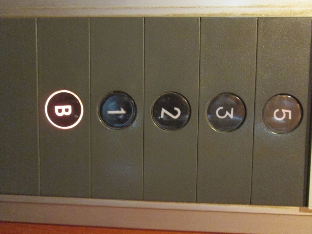 Elevator with missing 4th floor button.