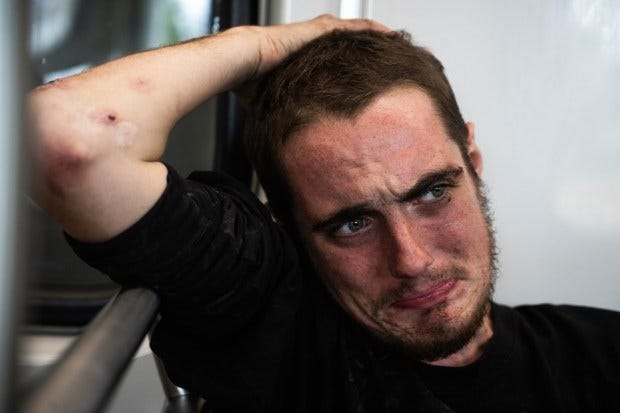 While riding the LA Metro to Long Beach to "boost" Elliot sheds tears as he talks about his family. (Photo by Sarah Reingewirtz, Los Angeles Daily News/SCNG)