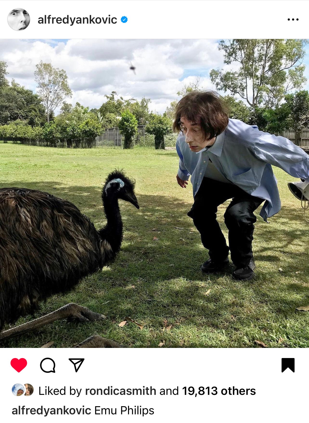 An emu with Emo Phillips bending down to bow in greeting, captioned "Emu Phillips."