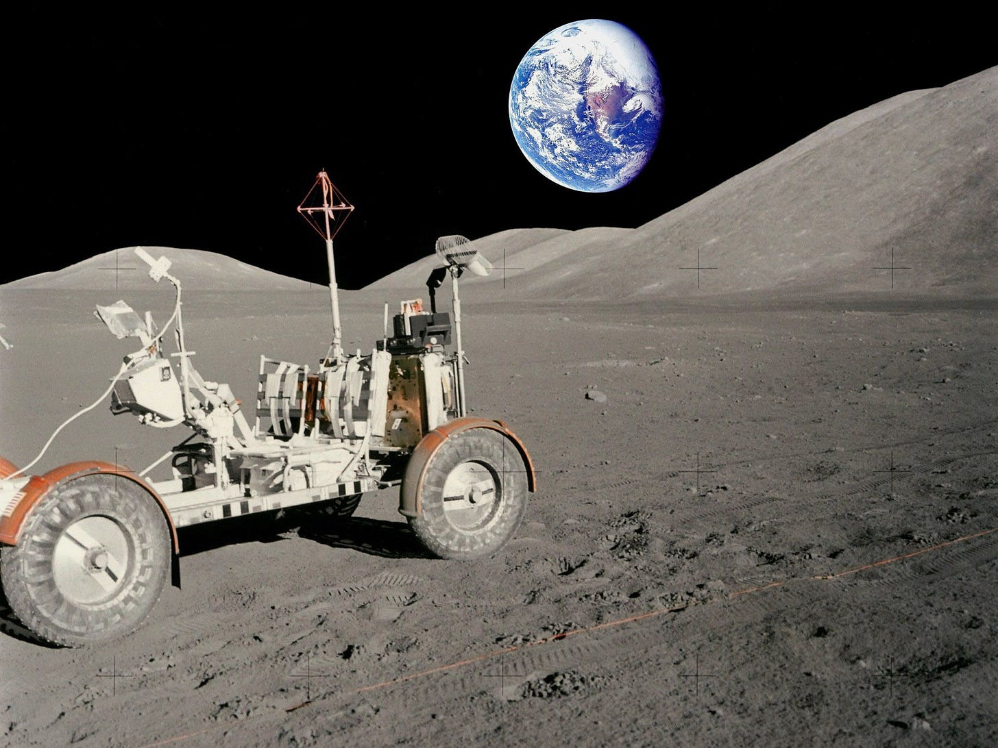 Earth seen from Moon with lunar rover in the foreground