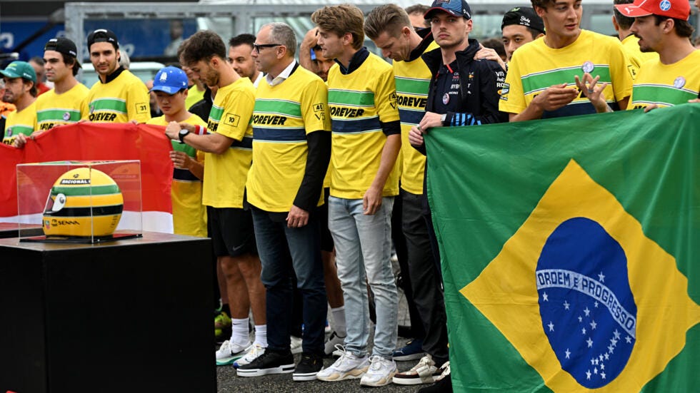 Tribute: Formula One drivers pay their respects to Ayrton Senna on the start line of the Autodromo Internazionale Enzo e Dino Ferrari race track in Imola