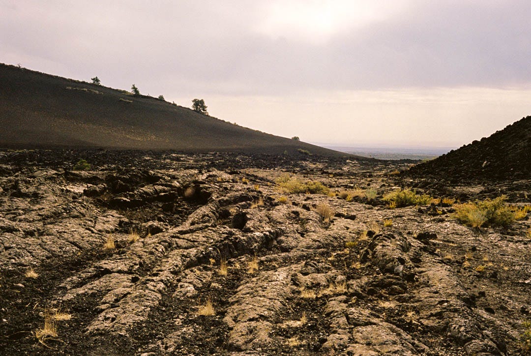 A photograph of a pitted, rocky valley.