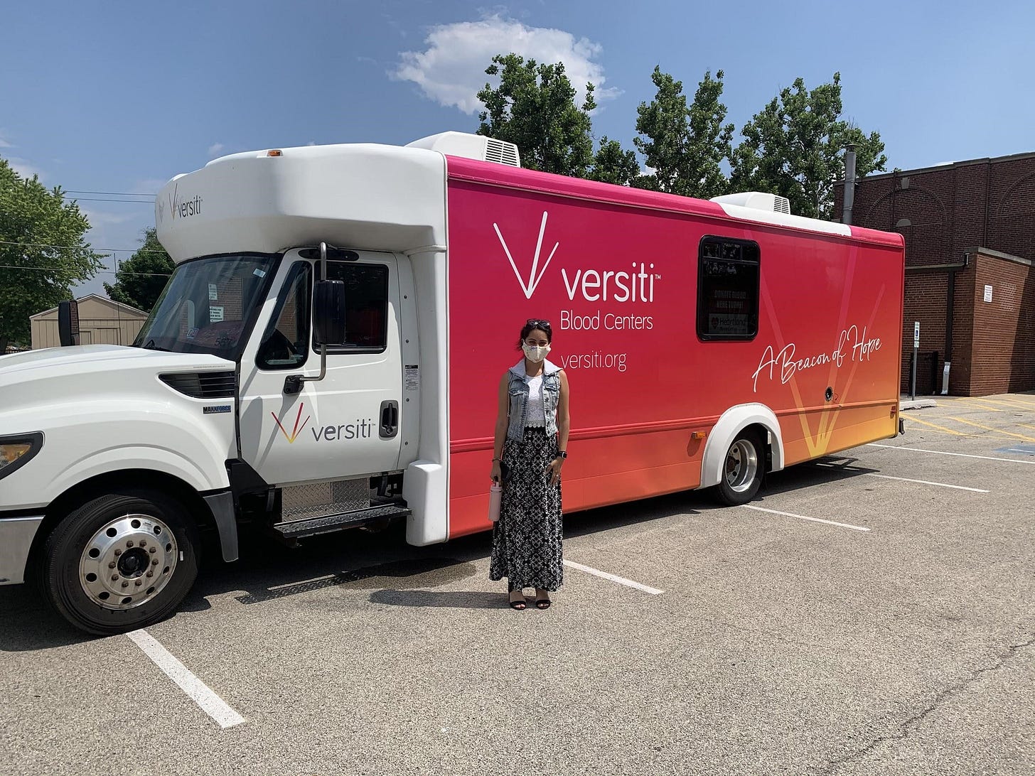 Pictured: State Representative Barbara Hernandez outside the Versiti Mobile Blood  Donation Bus.