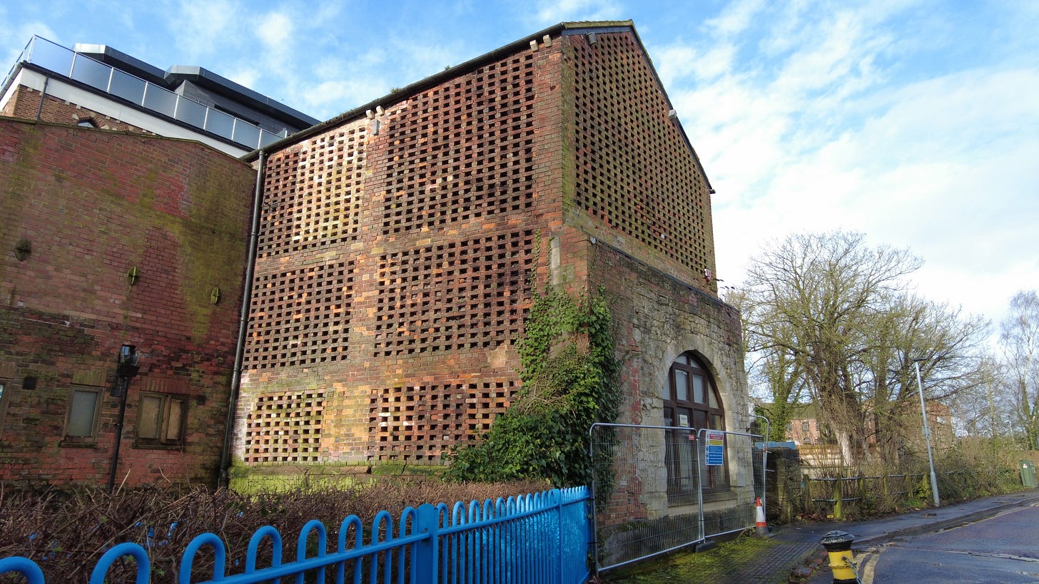 Handle House is a drying house. The walls have missing bricks to allow the air to flow through to dry teasels. It is situated on a bridge spanning the River Biss, as it flows through Trowbridge. Image: Roland Millward