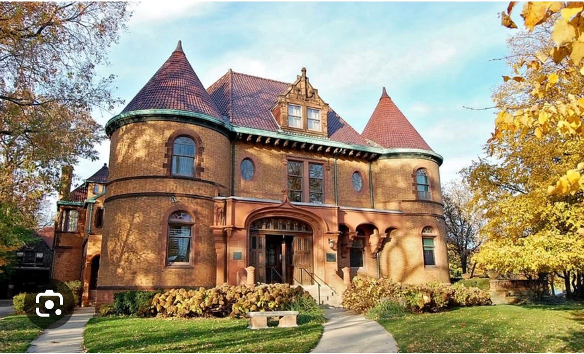 Exterior photo of the Chateauesque-style Evanston History Center overlooking Lake Michigan