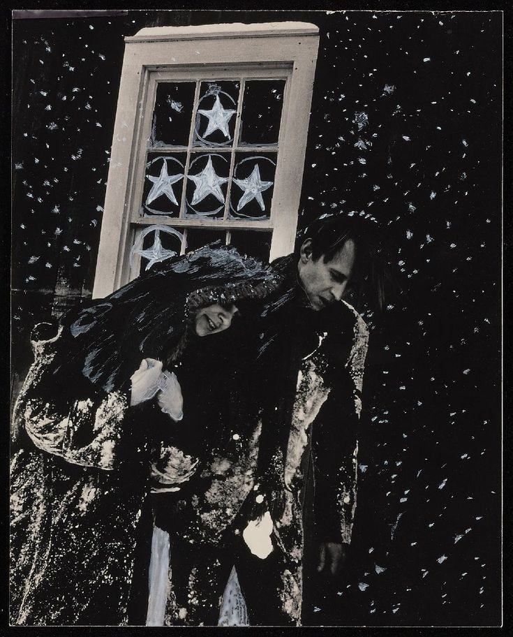 This may contain: two people standing next to each other in front of a window with stars on it This may contain: two people standing next to each other in front of a window with stars on it