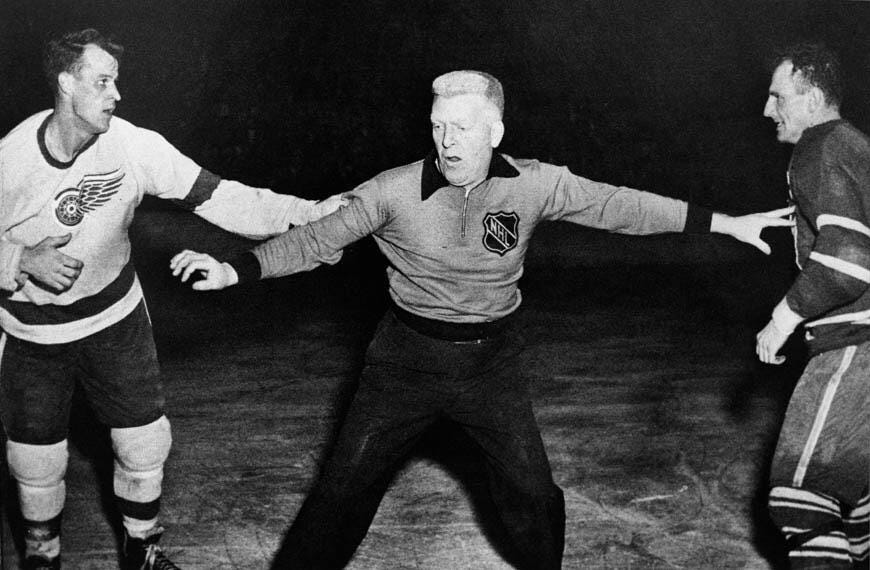 It's the off-season, which means more vintage hockey photos. [Canadian NHL  referee and former professional football player, Red Storey, (center) gets  in between Gordie Howe of the Detroit Red Wings (left) and