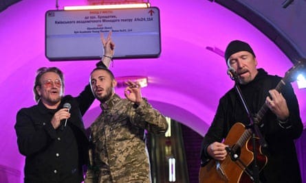 Taras Topolia, centre, performing with Bono and The Edge of U2, in a subway station converted into a bomb shelter, Kyiv, 8 May 2022.