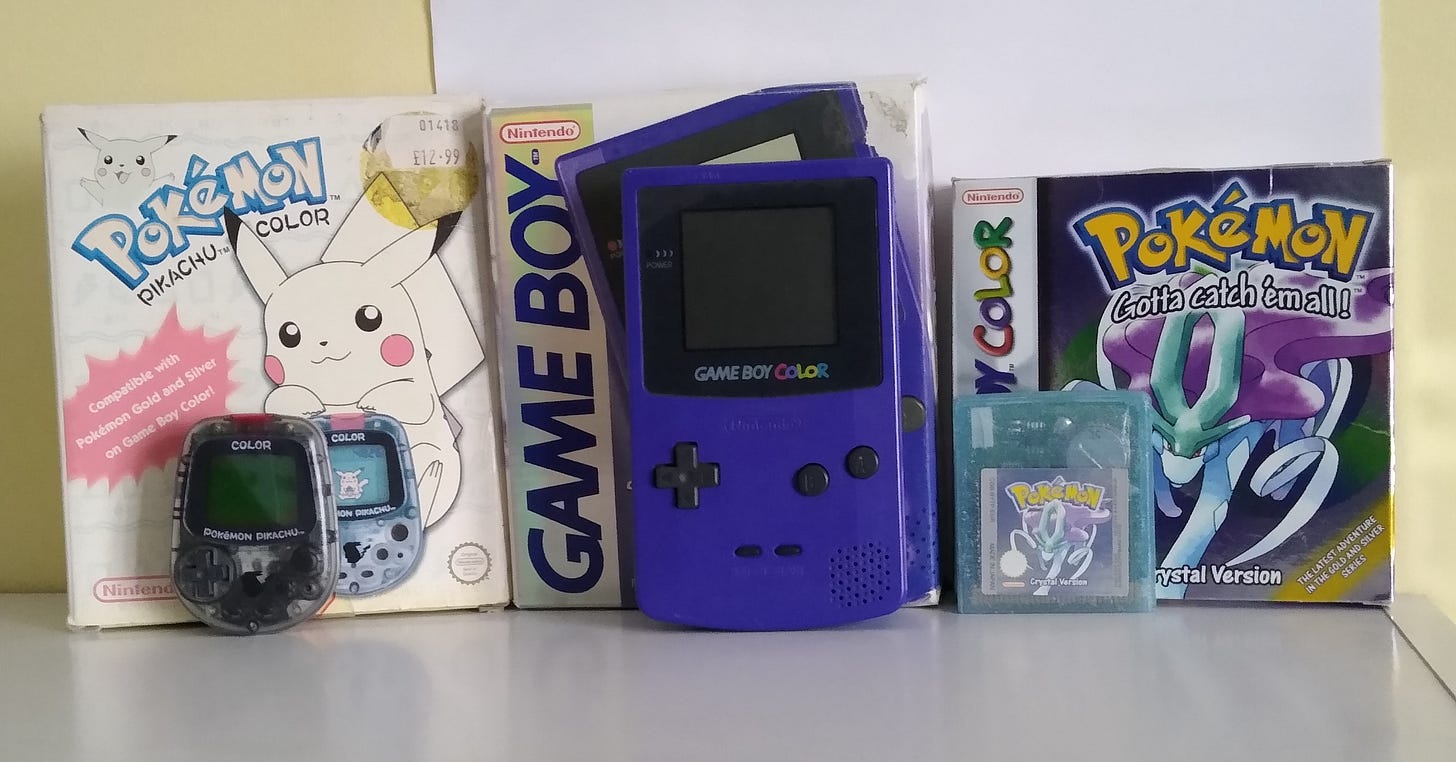 My original copy of Pokémon Crystal, Pocket Pikachu Color, and Game Boy Color