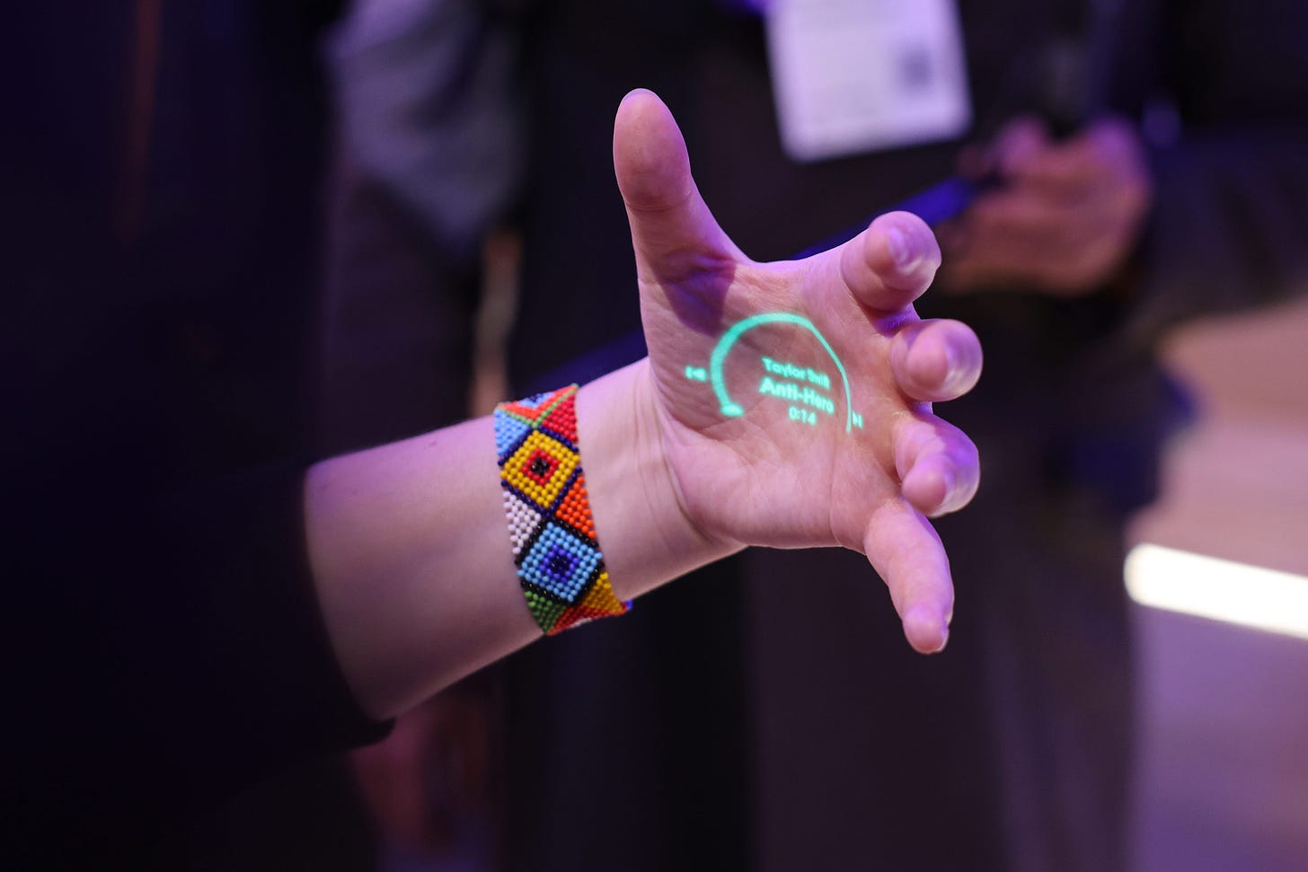 A demonstration of the&nbsp;the laser ink display projection of a wearable Humane Inc. AI pin.