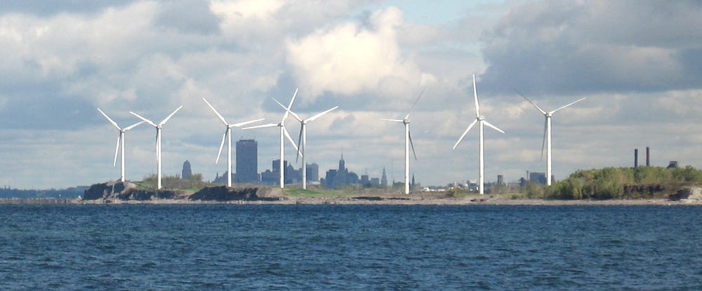 Nine of fourteen wind turbines on the edge of Lake Erie and downtown Buffalo, NY.