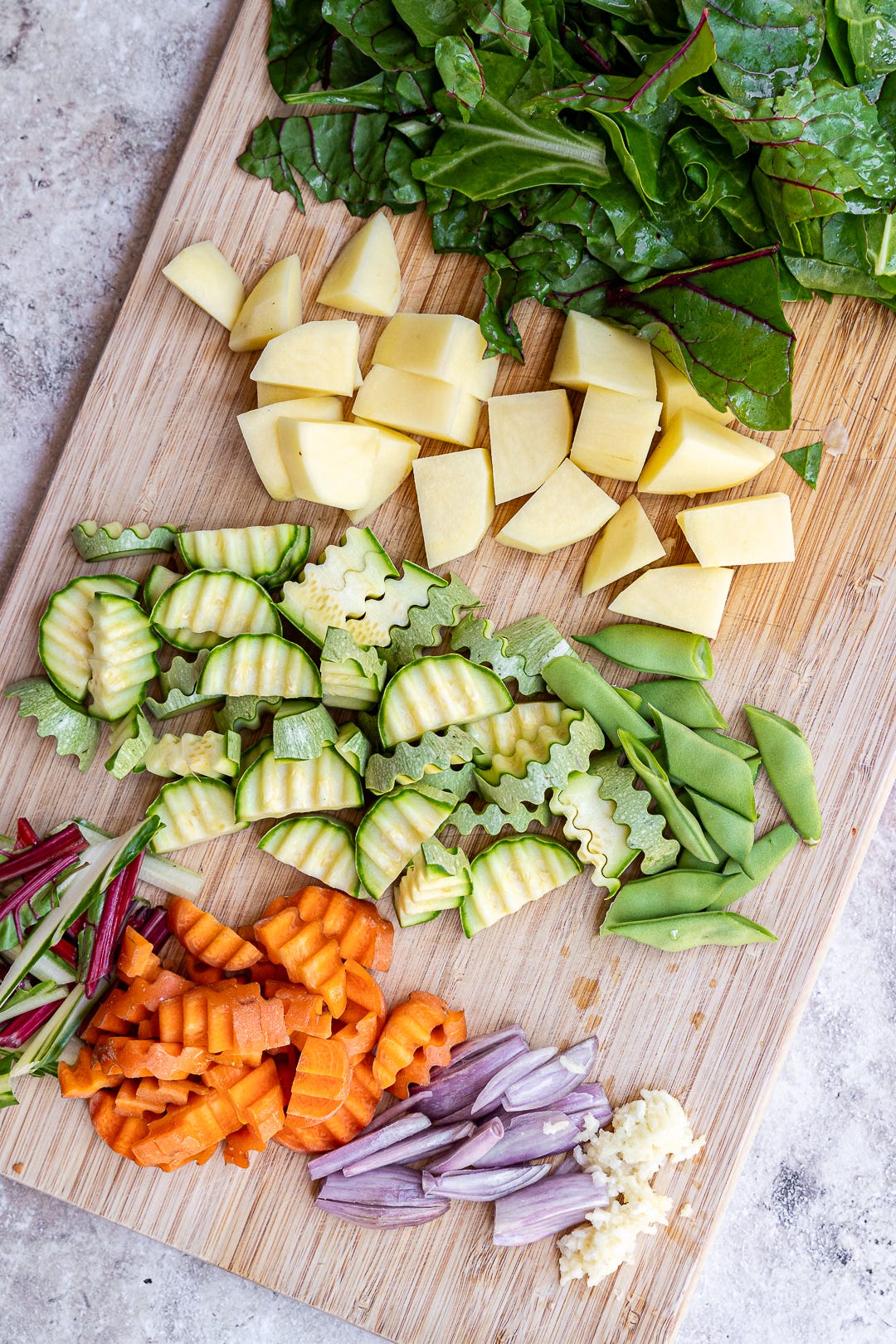 Chopped ingredients for curry on wooden board