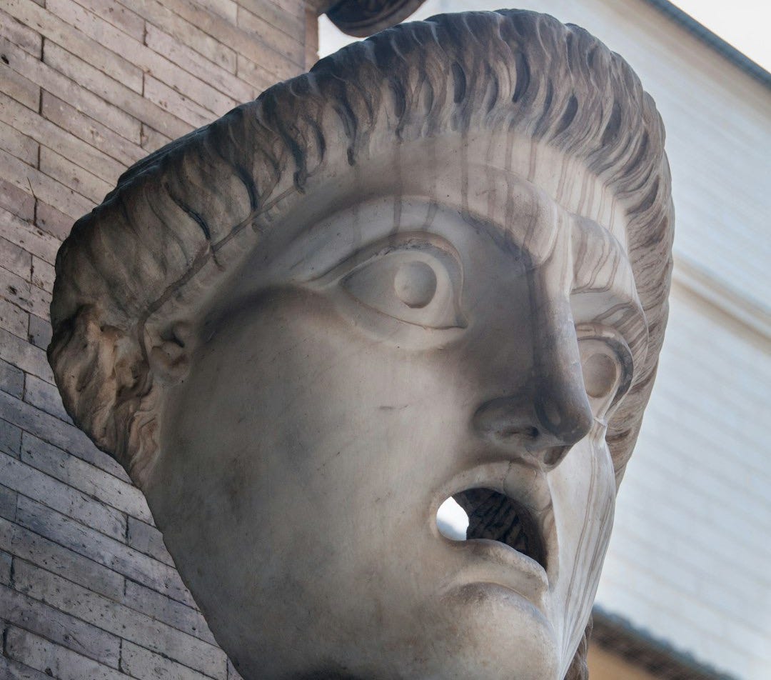 a close up of a statue of a man's head