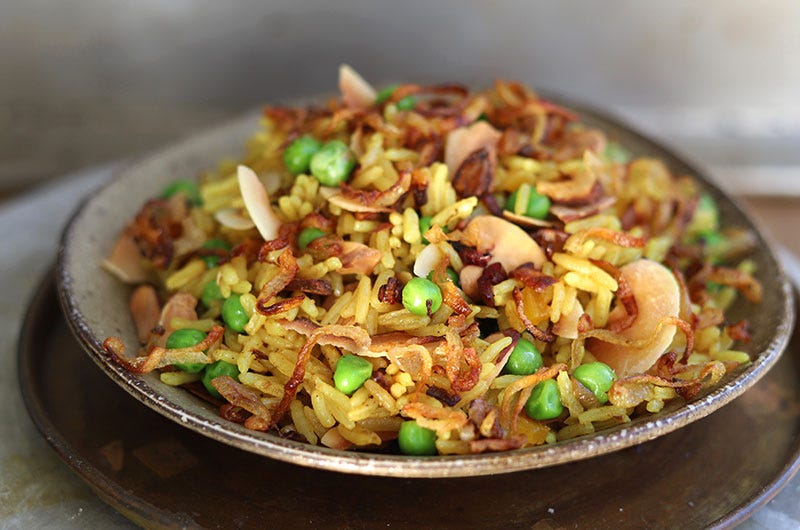 Curried Rice Pilaf with Peas, Crispy Shallots, Almonds, and Coconut