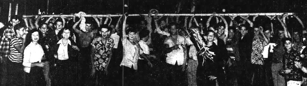 Figure 2: Students from Edison High School marching the goal post out of the Orange Bowl. Courtesy of Miami News.