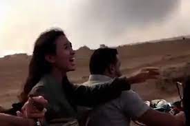 Image of a woman being kidnapped taken from a Hamas video