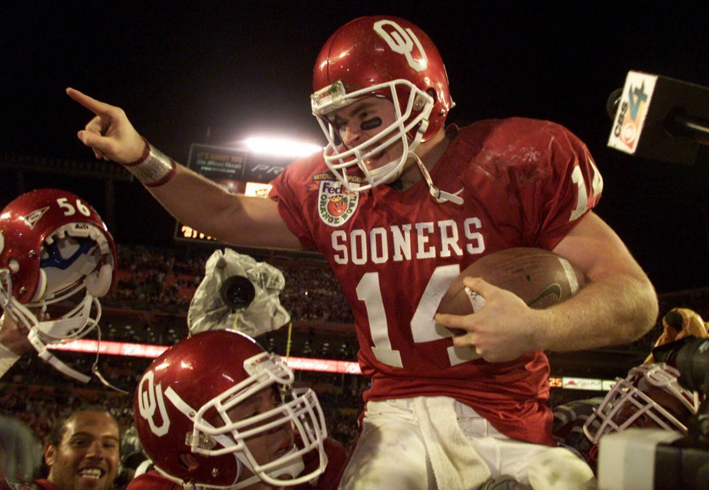 Photo of OU quarterback Josh Heupel celebrating the 2000 national championship