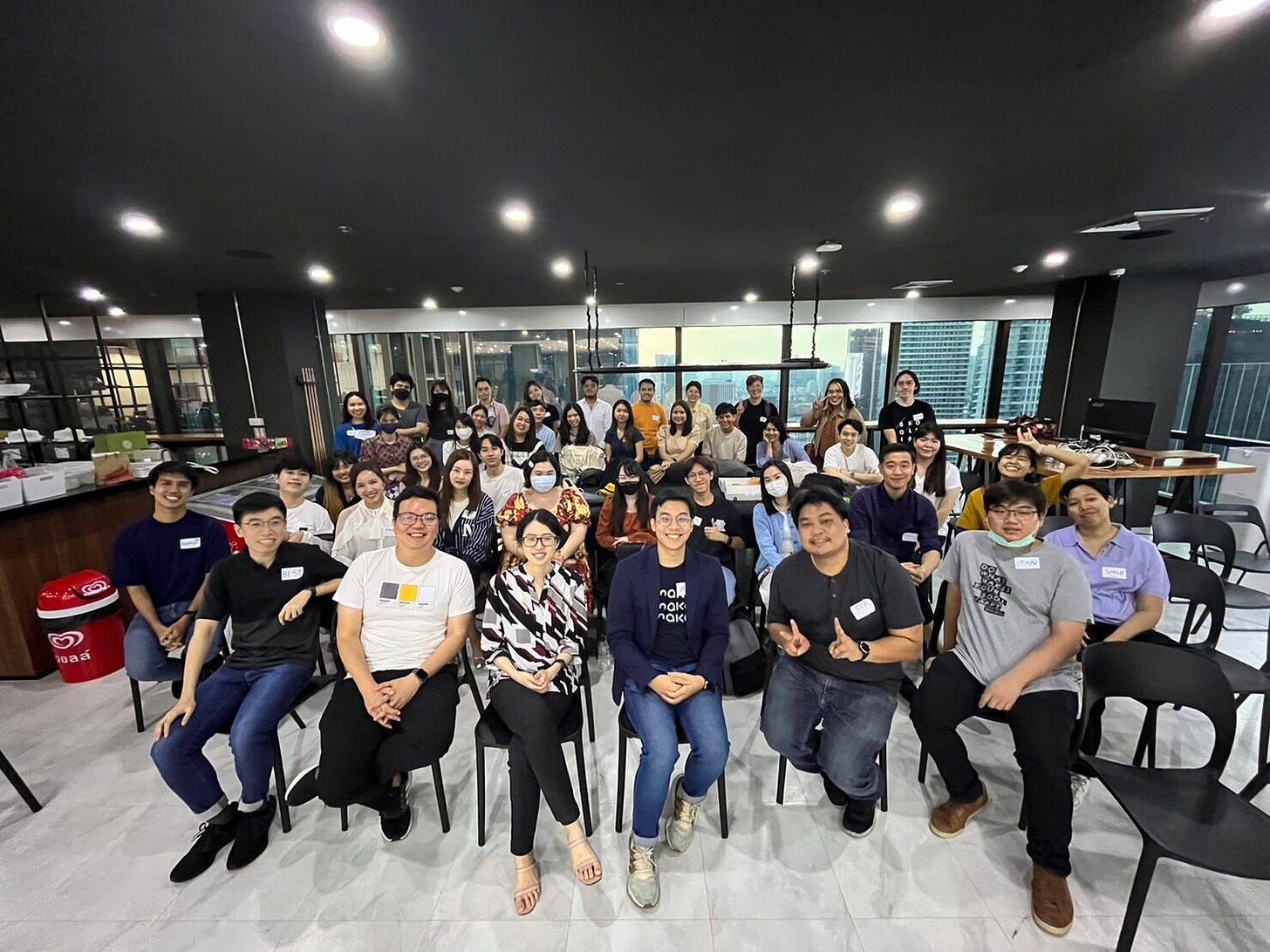 May be an image of 4 people, people smiling, people studying and text