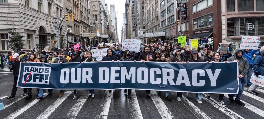 A group of people holding a banner

AI-generated content may be incorrect.