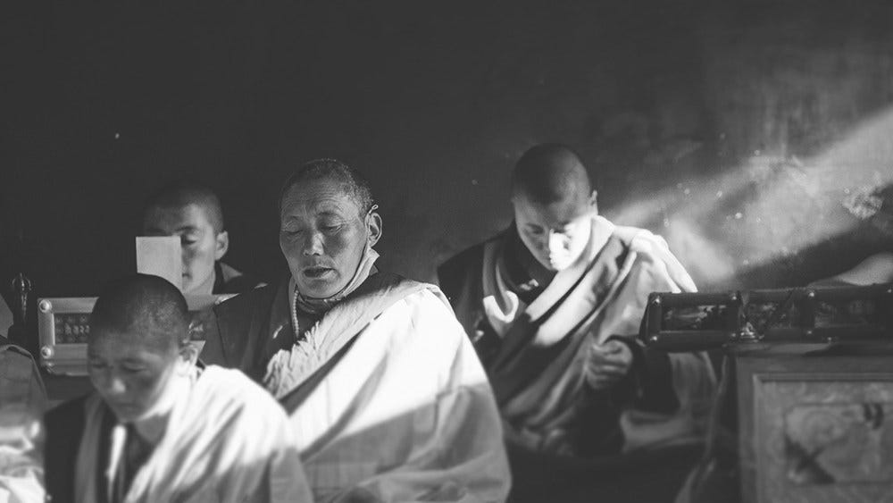 May be a black-and-white image of 3 people and temple