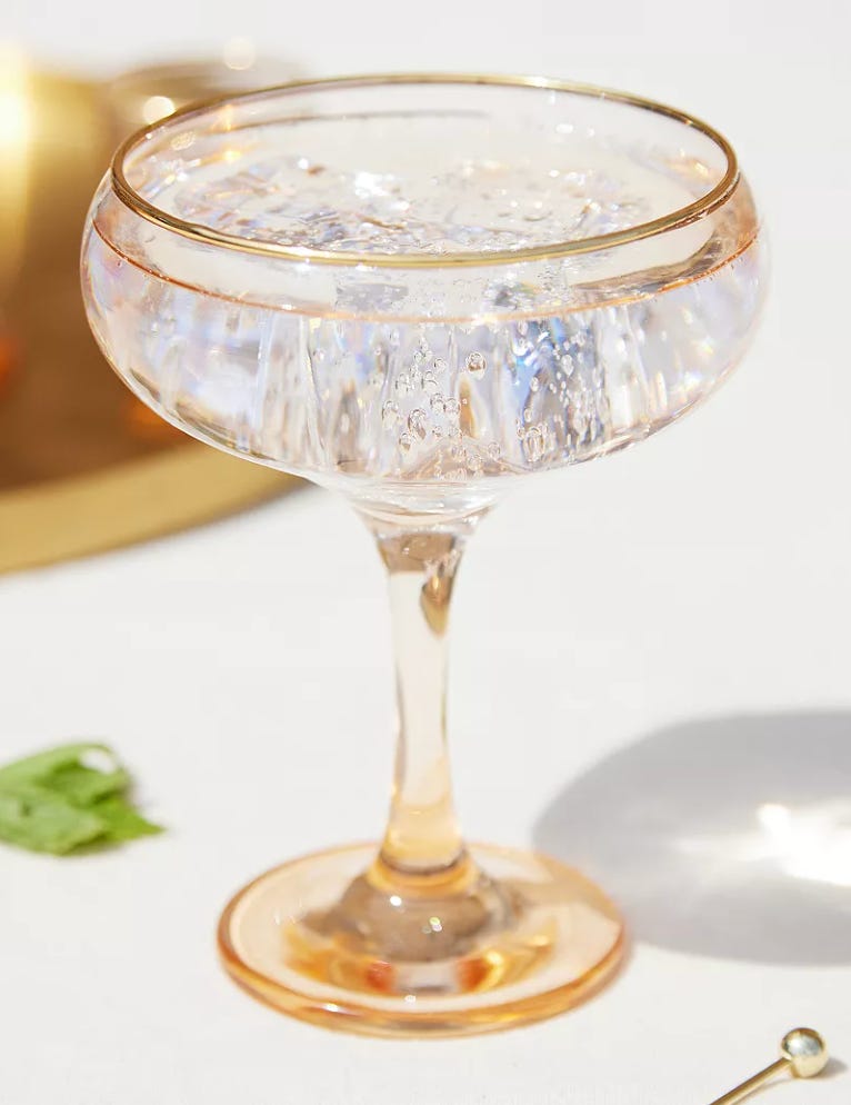 champagne coupe with gold rim