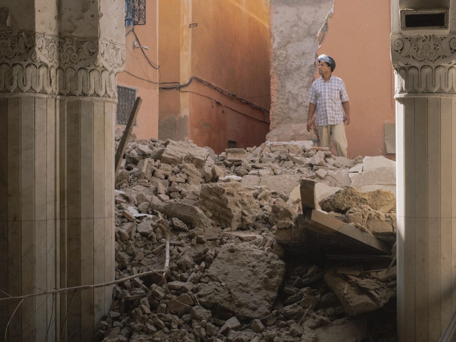 A man inspects the damage caused by the earthquake in the old Medina of Marrakech, Morocco.