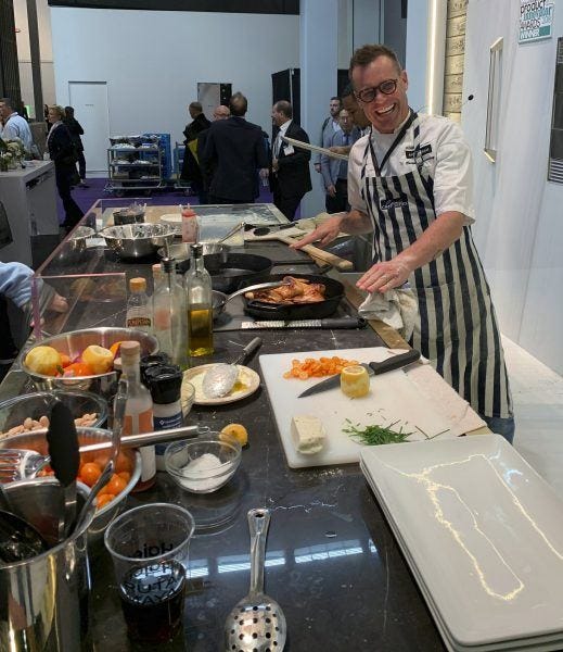 Brian Malarkey shows off ge induction appliances for hi tech kitchens