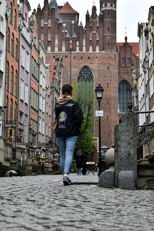 Free Woman on Street in Old Town Stock Photo