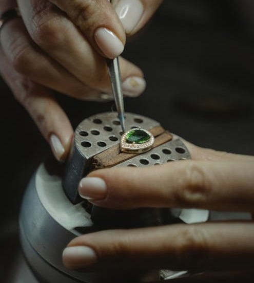 Free A Jeweler Making an Emerald Ring Stock Photo