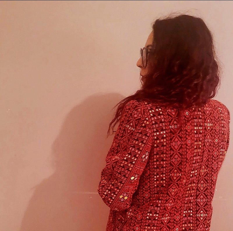 Me in my mom’s authentic Palestinian tatreez jacket