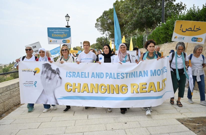 From the Women Wage Peace and Women of the Sun march on October 4, 2023. Three days before the Hamas bombing. The groups had an entire autumn of actions planned, if I understand correctly. Meant to bring everyone back to the negotiating table. For peace. Israeli and Palestinian women marching with a sign that says in English, "Israeli and Palestinian Moms Changing Reality"