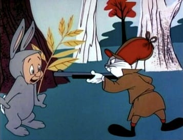 Elmer Fudd is dressed like Bugs Bunny; Bugs Bunny is dressed like Elmer Fudd.