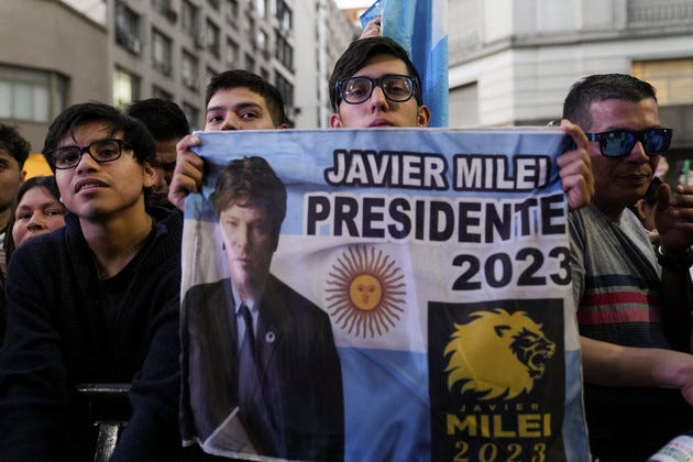 Supporters hold a banner of opposition presidential candidate Javier Milei   in Buenos Aires, Argentina, on Nov. 19, 2023. 