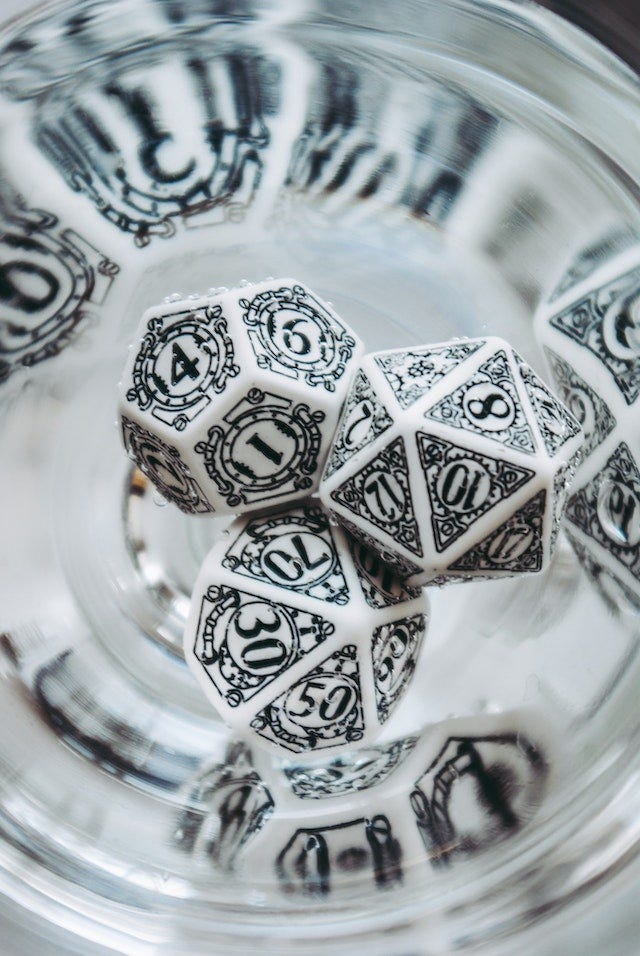 A close-up shot of white ttrpg dice