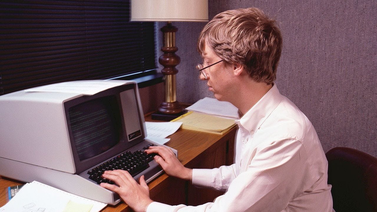 Bill Gates on a computer in 1984.