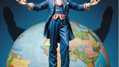 A person in a blue suit standing in front of a globe

Description automatically generated