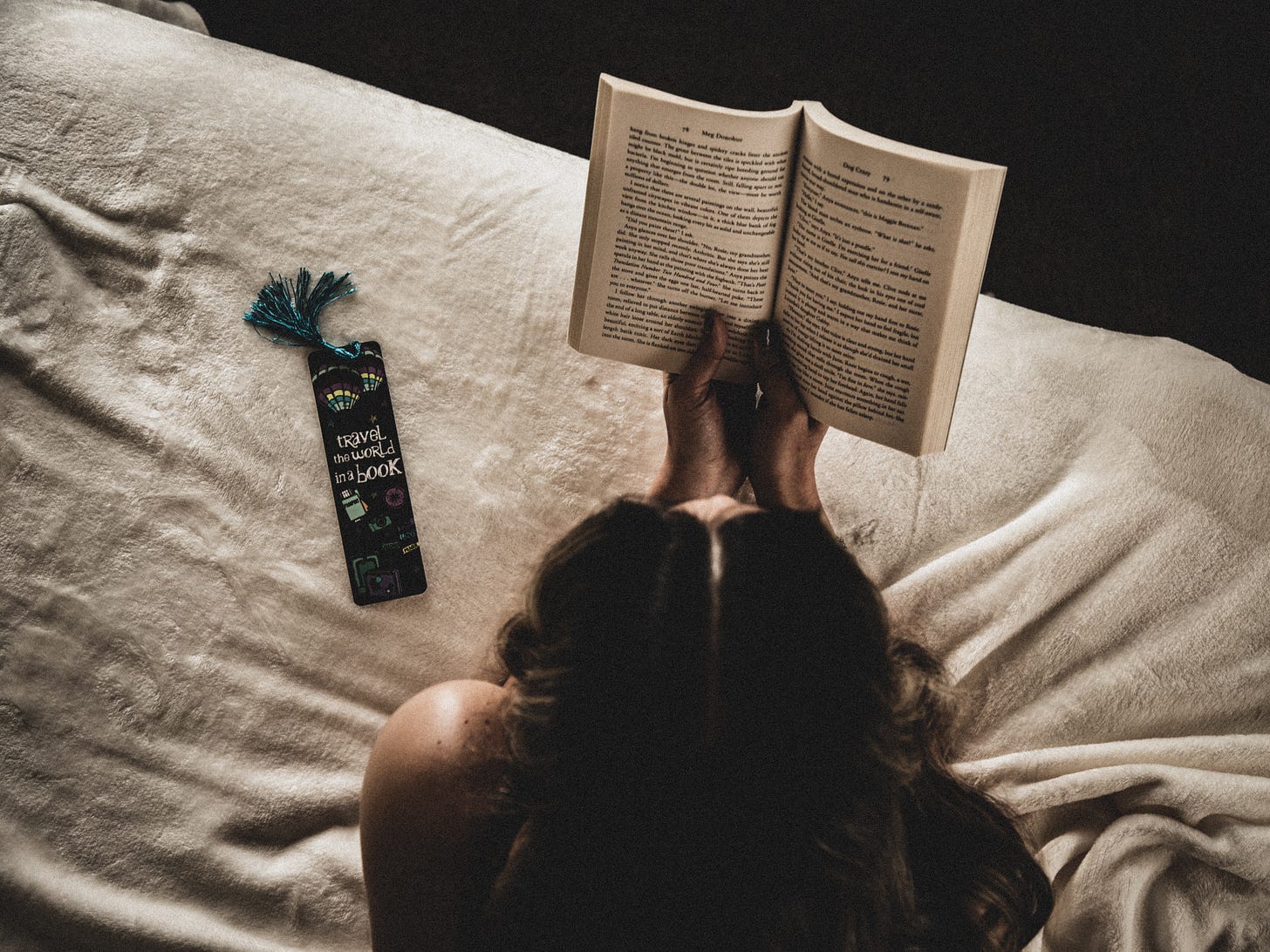 Woman reading a book. Photo by Edgar Colomba from Pexels