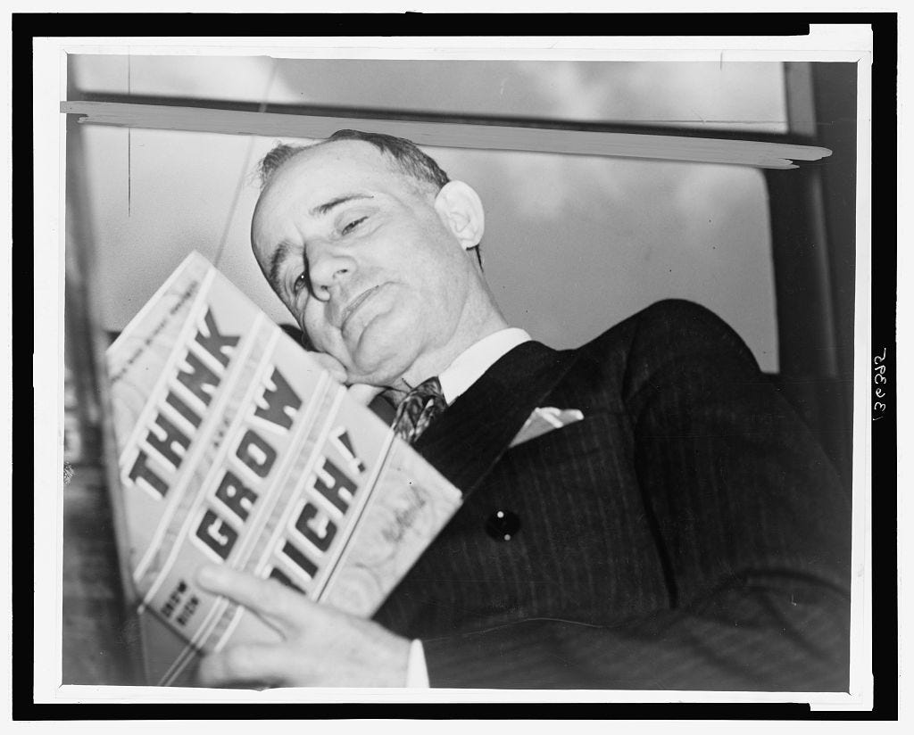 Napoleon Hill, attorney and journalist, holding his book, "Think and Grow  Rich"] | Library of Congress