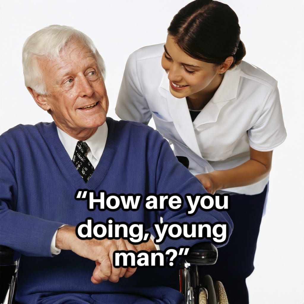 Questioning white man, 80, with gray hair, sits in wheelchair, while female attendant makes a comment at his side, "How are you doing, young man?" 