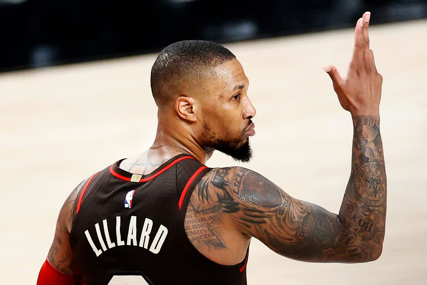 PORTLAND, OREGON - JUNE 03: Damian Lillard #0 of the Portland Trail Blazers reacts after his three point basket in the second quarter against the Denver Nuggets during Round 1, Game 6 of the 2021 NBA Playoffs at Moda Center on June 03, 2021 in Portland, Oregon. NOTE TO USER: User expressly acknowledges and agrees that, by downloading and or using this photograph, User is consenting to the terms and conditions of the Getty Images License Agreement. (Photo by Steph Chambers/Getty Images)