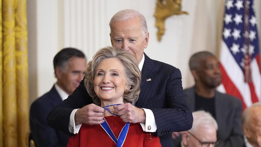 US President Joe Biden presents the Presidential Medal of Freedom to ...