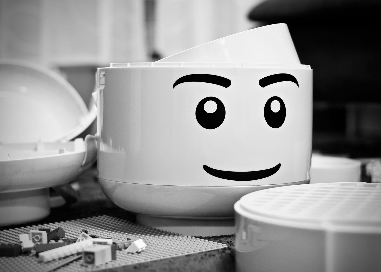 Grayscale photography of lego piece plastic toy photo