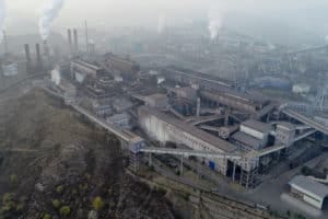 Aerial view of big factory in China.Air pollution by smoke coming out of chimneys. Coal Fossil Fuel Power Plant Smokestacks Emit Carbon Dioxide Pollution. Chengde, China. 10/22/2018
