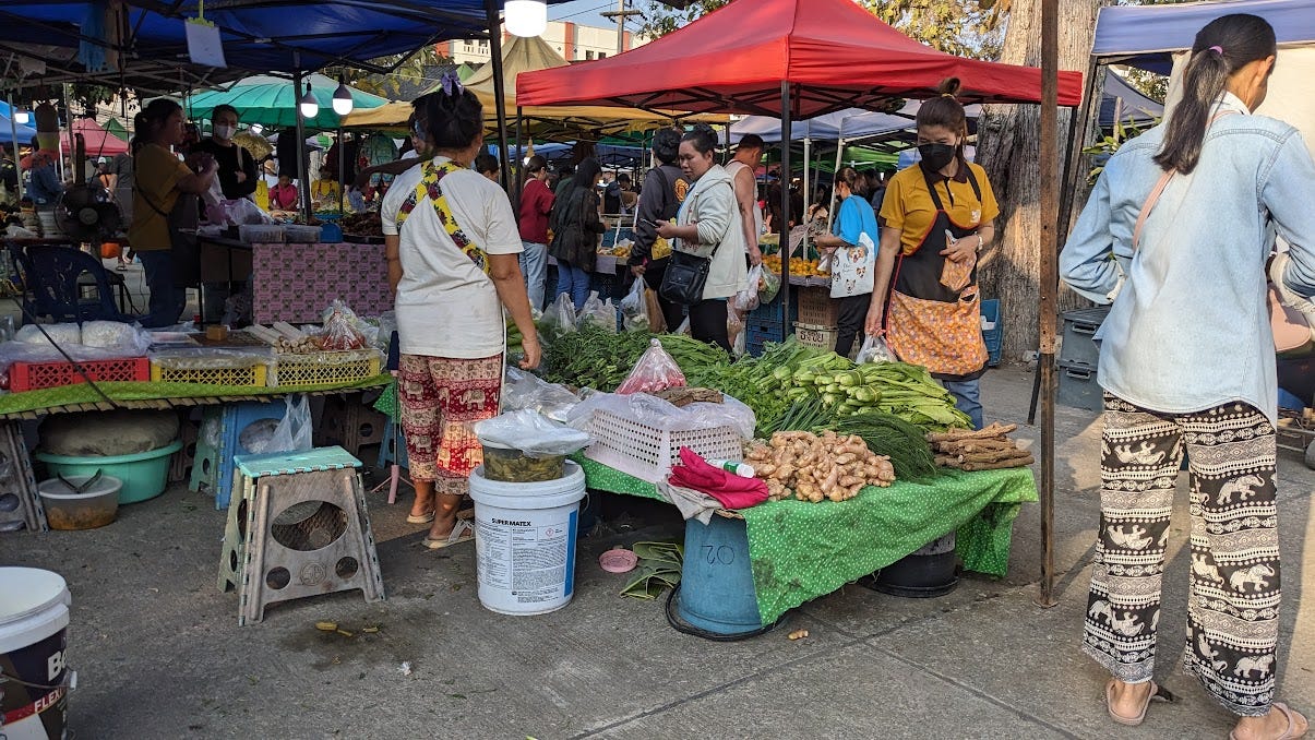 vendor table at a local thai produce market vendor table at a local thai produce market
