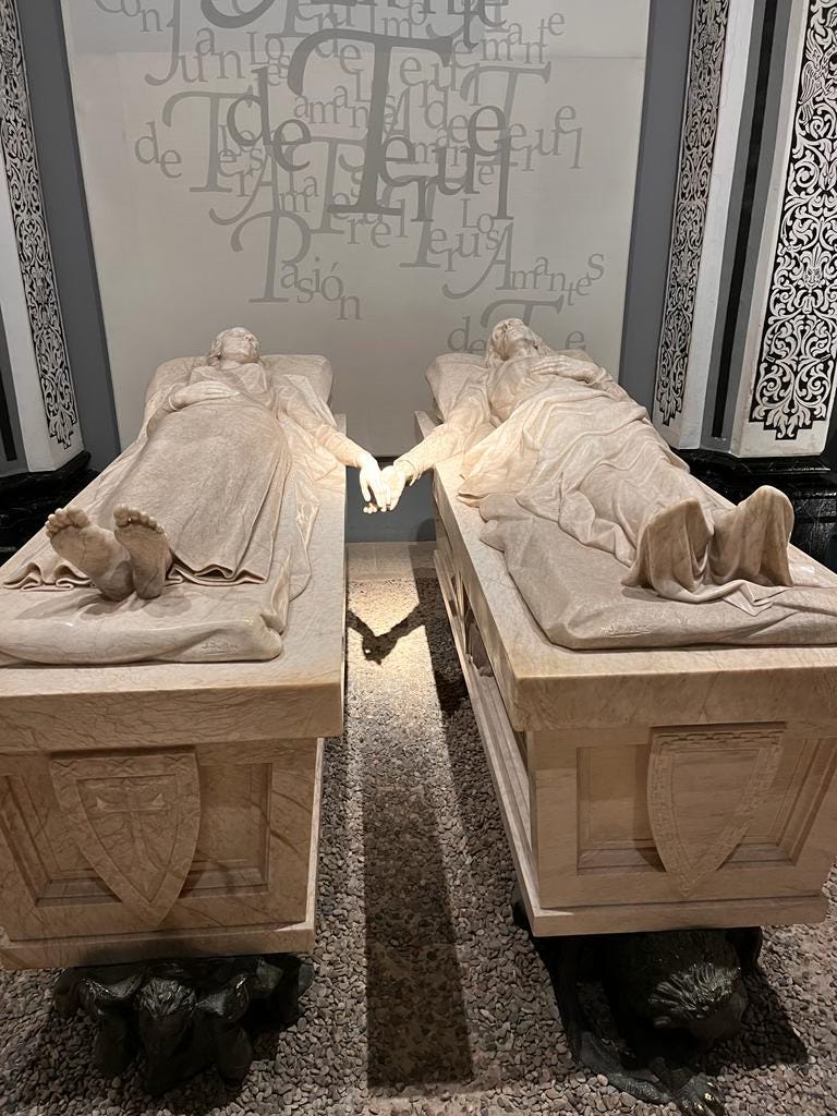 Two sarcophagi of the lovers - their effigies are reaching out to each other, with their hands almost, but not quite touching each other.