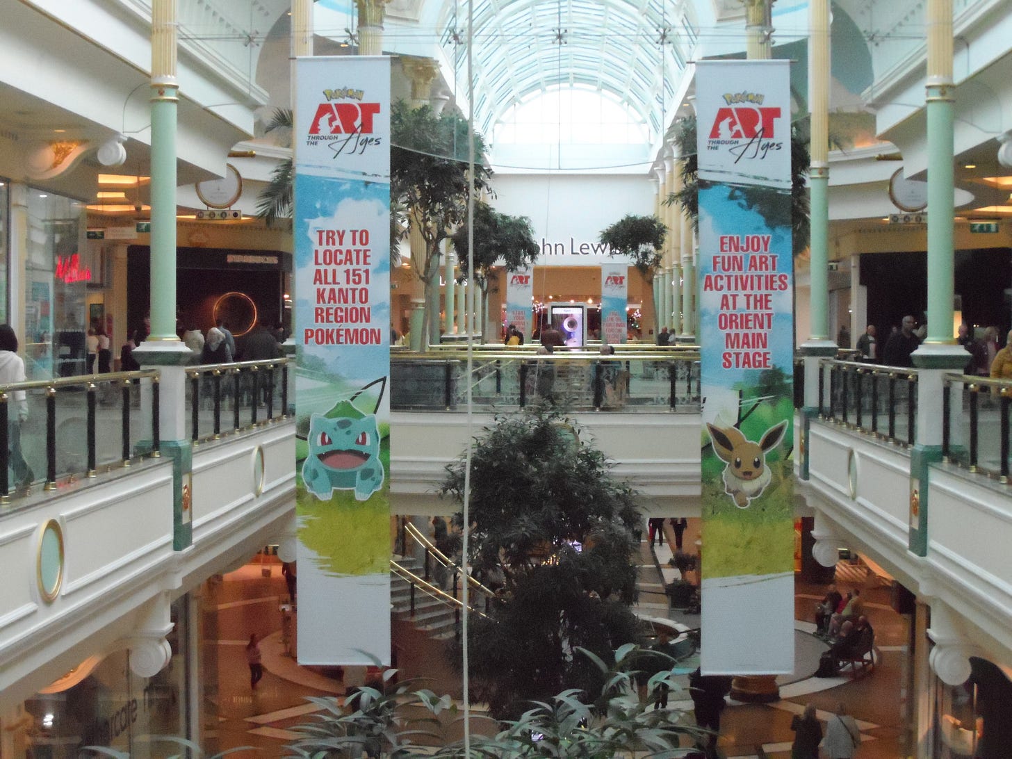 Banners featuring Bulbasaur and Eevee hung down from the first floor